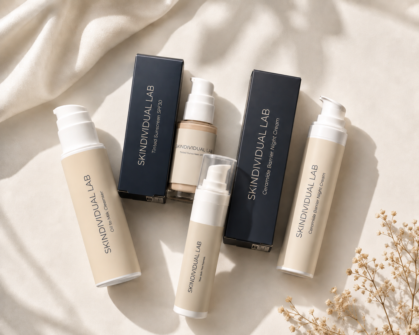 Skindividual Lab prescription skincare range Belfast — Oil to Milk Cleanser, Tinted Sunscreen SPF30, Ceramide Barrier Night Cream and bespoke tretinoin cream, compounded and delivered across Northern Ireland