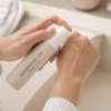 Applying Skindividual Lab Oil-to-Milk Cleanser to the back of the hand