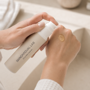 Applying Skindividual Lab Oil-to-Milk Cleanser to the back of the hand
